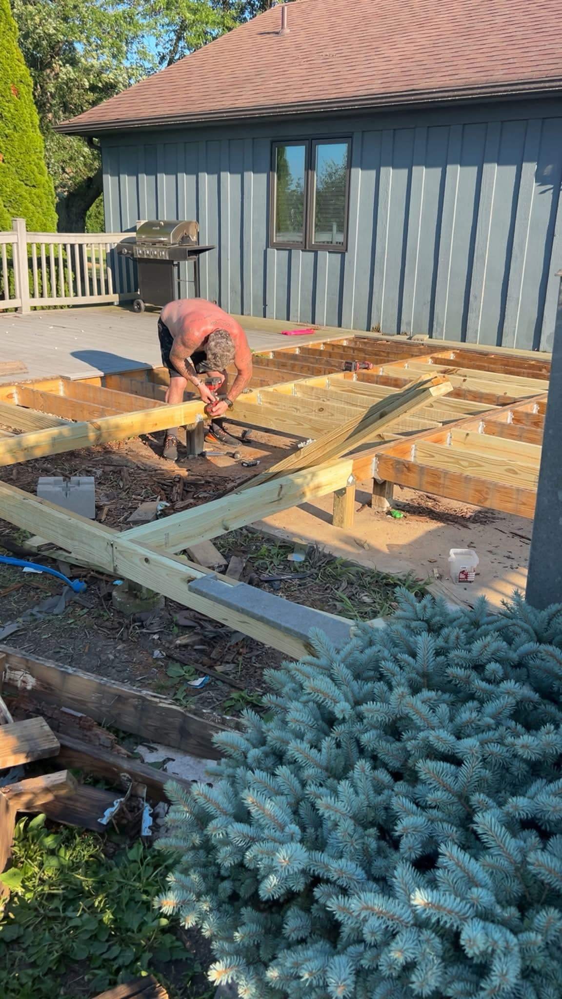 Corner Construction crew member building a deck frame